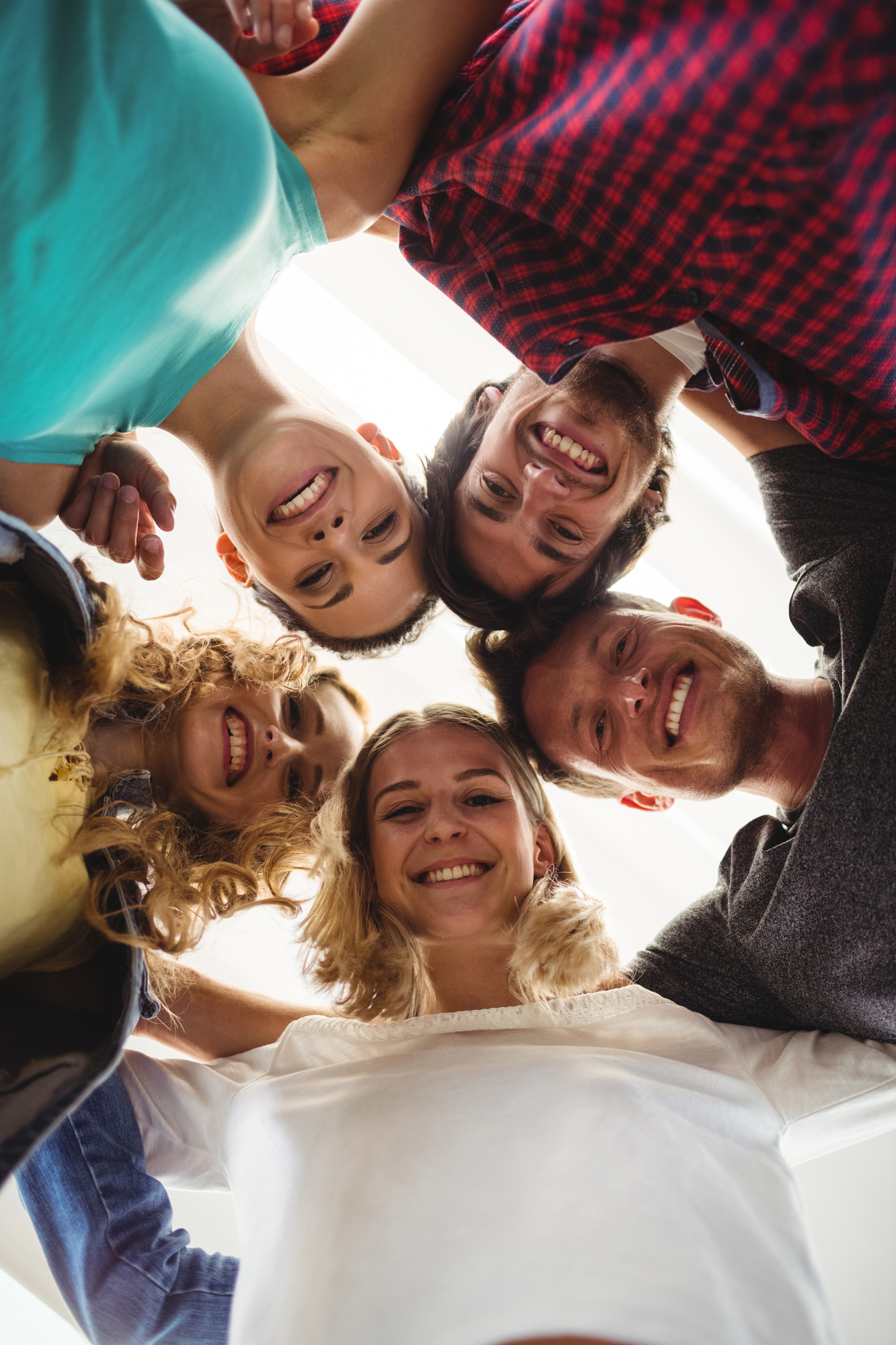 Group-business-executives-forming-huddle